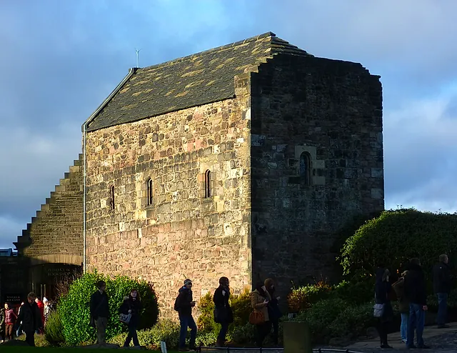 St Margaret's Chapel, the small 12th-century stone chapel on the castle rock under a dramatic sky