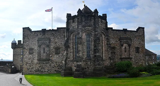 The Scottish National War Memorial in Edinburgh Castle: the weathered stone building with its tall central bay and a flag flying above